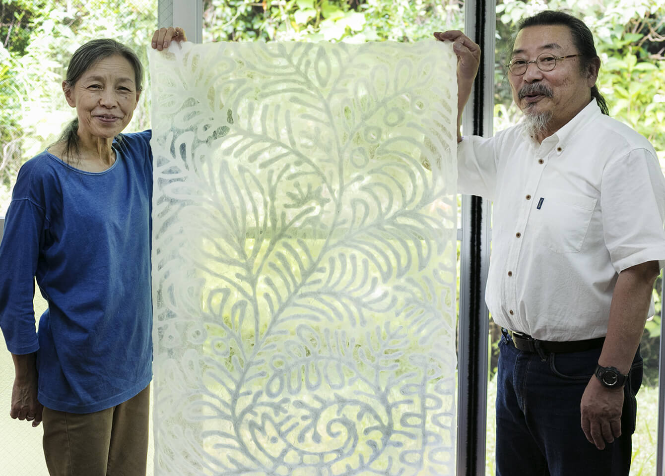 Daylight from the window passes through the washi, revealing in its white and transparent areas a work of art